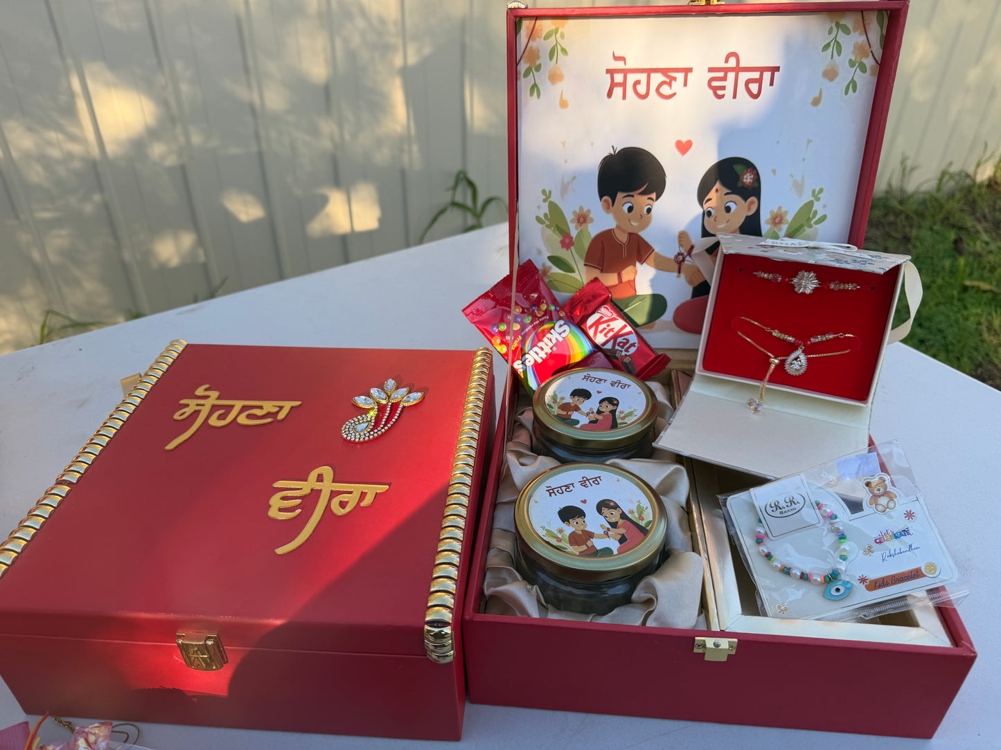 Beautiful Rakhi Hamper box (includes nuts , Bro-Bhabi combo set , kids rakhi