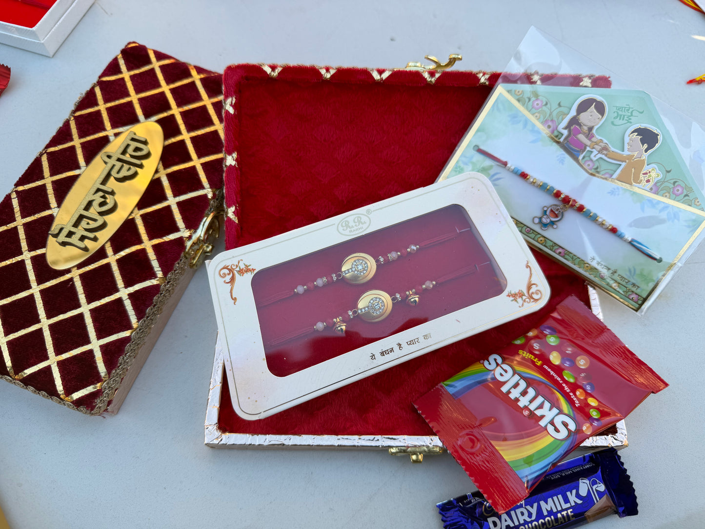 Assorted Family small Hamper box (Includes combo Rakhi +kids rakhi + skittles & choclate