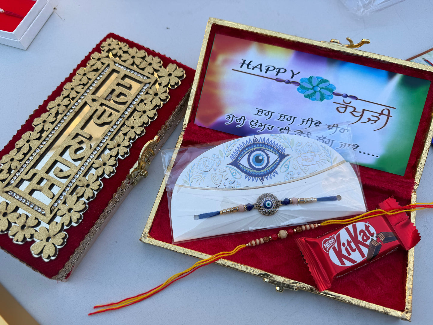 Assorted Small hamper box with 2 rakhies & chocolate