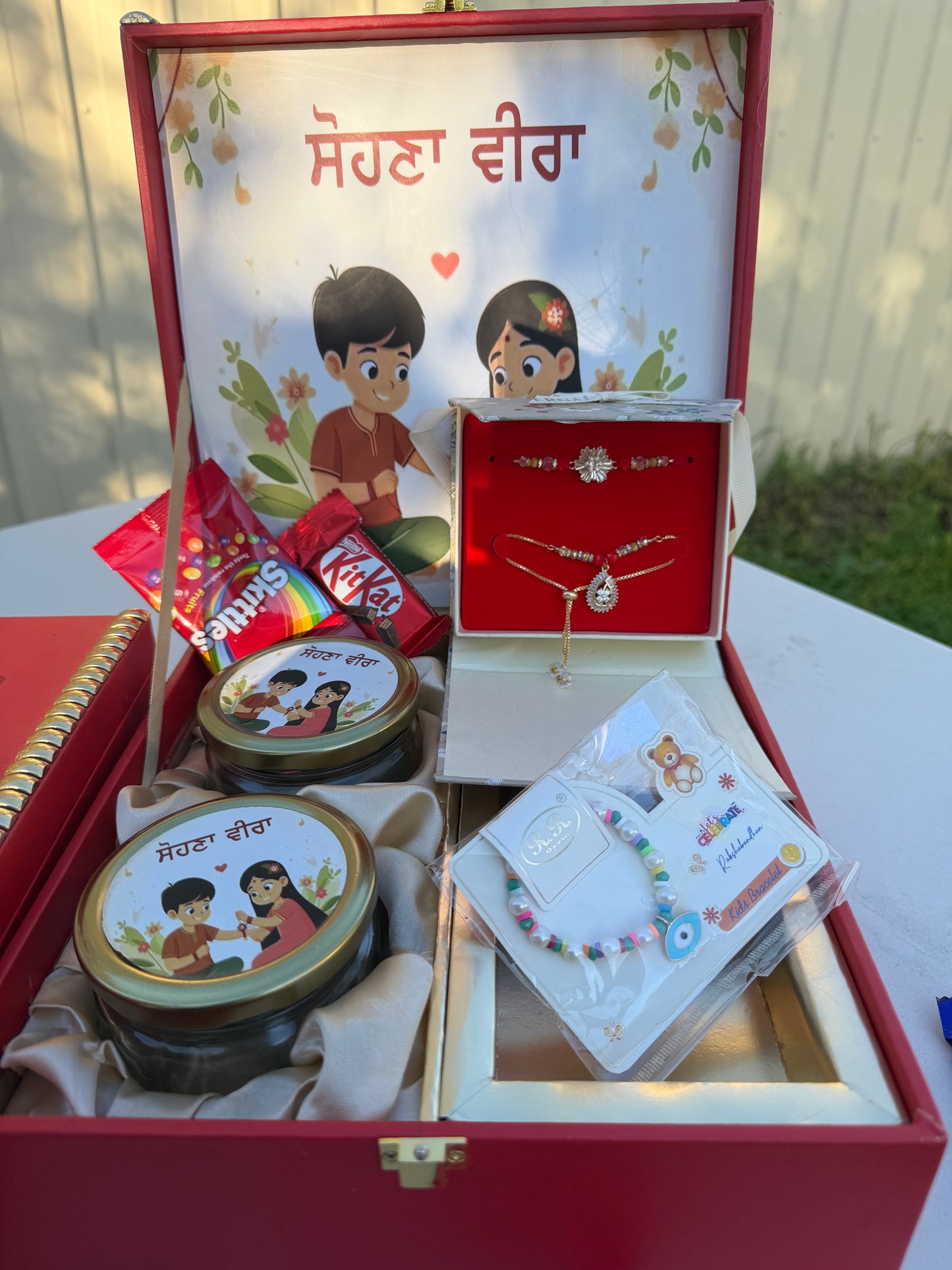 Beautiful Rakhi Hamper box (includes nuts , Bro-Bhabi combo set , kids rakhi