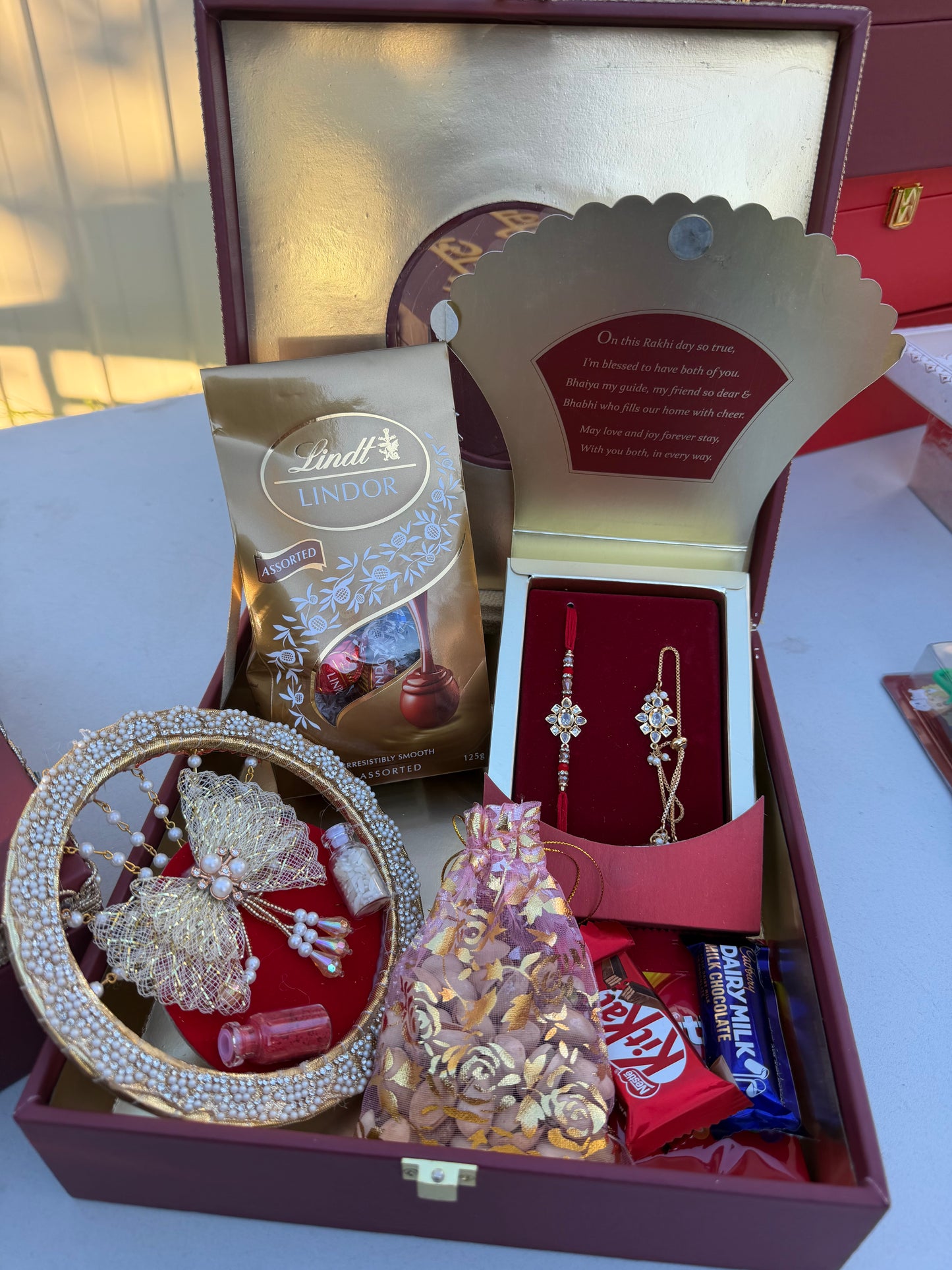 Sohna veera Rakhi Hamper Box (includes Bro-Bhabi combo set , Roli-Chawl thali , chocolate packing , nuts , chocolates & skittles )