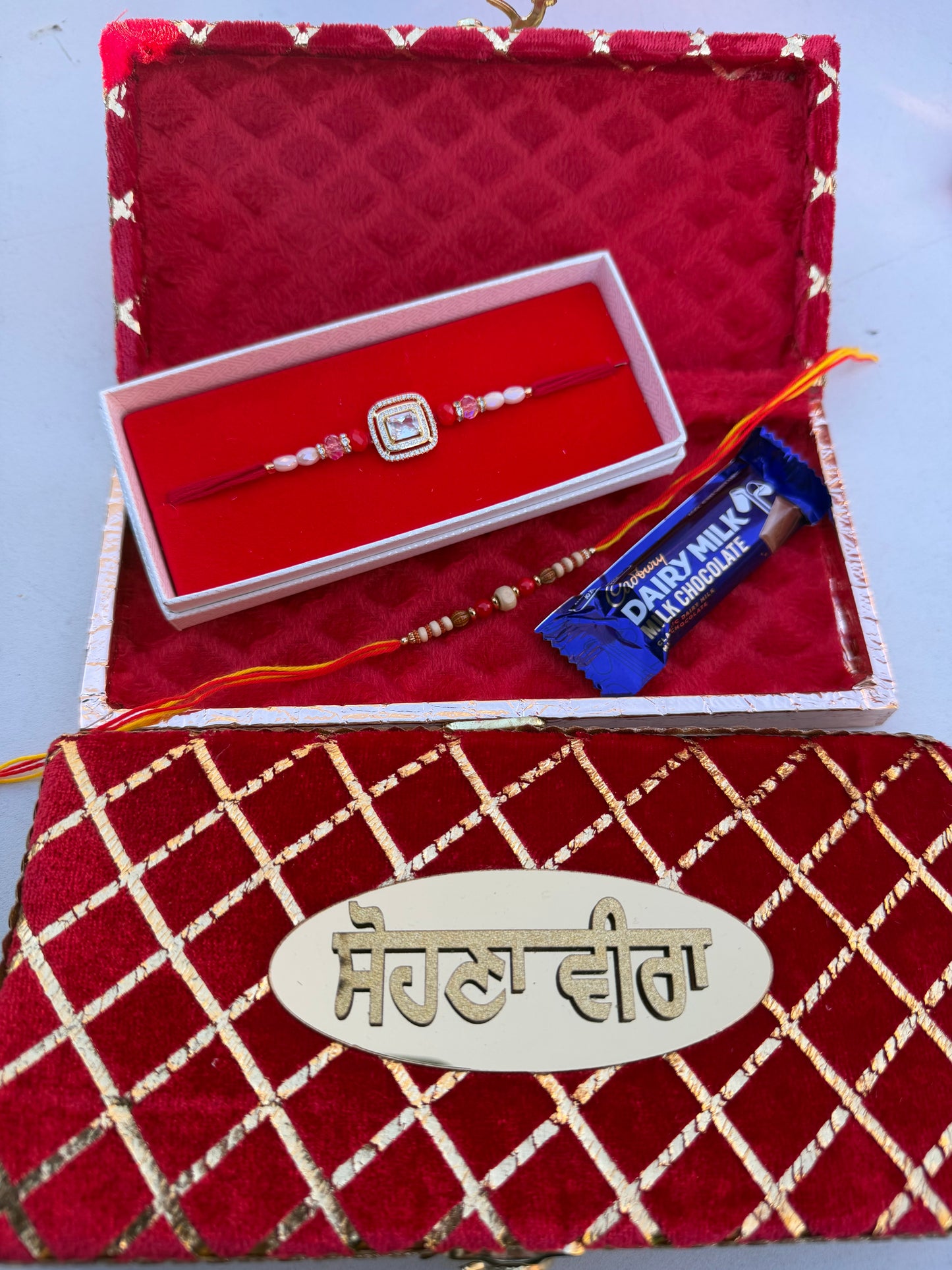 Small hamper box with assorted 1 AD rakhi + 1 thread & chocolate