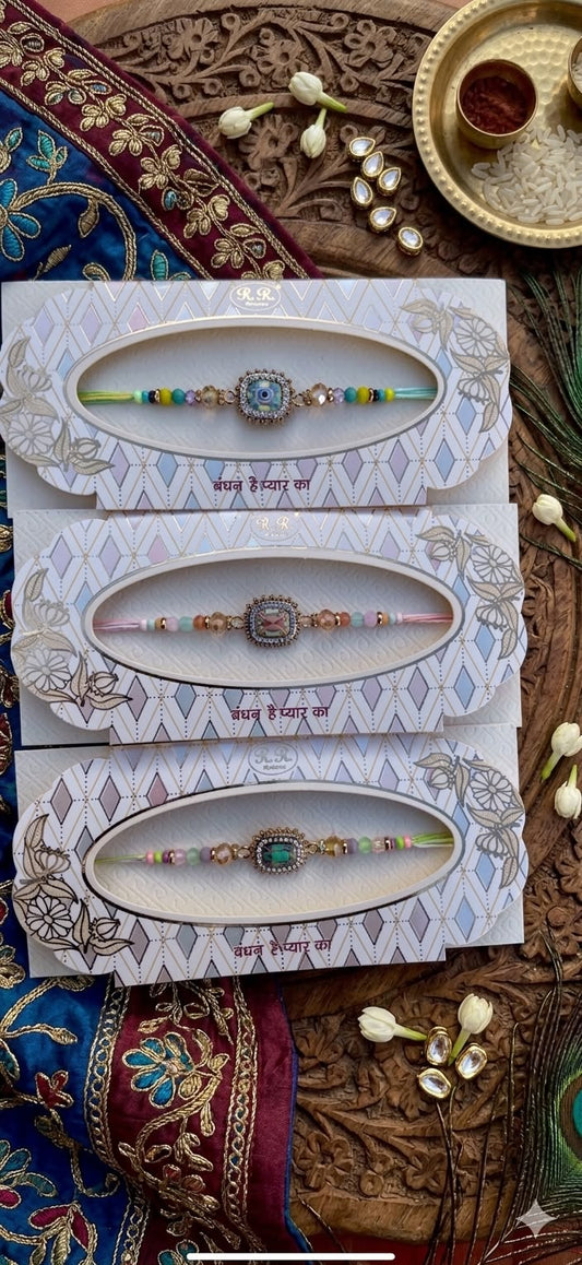 Assorted Light Multicoloured Rakhies with AD touch (per Pc)